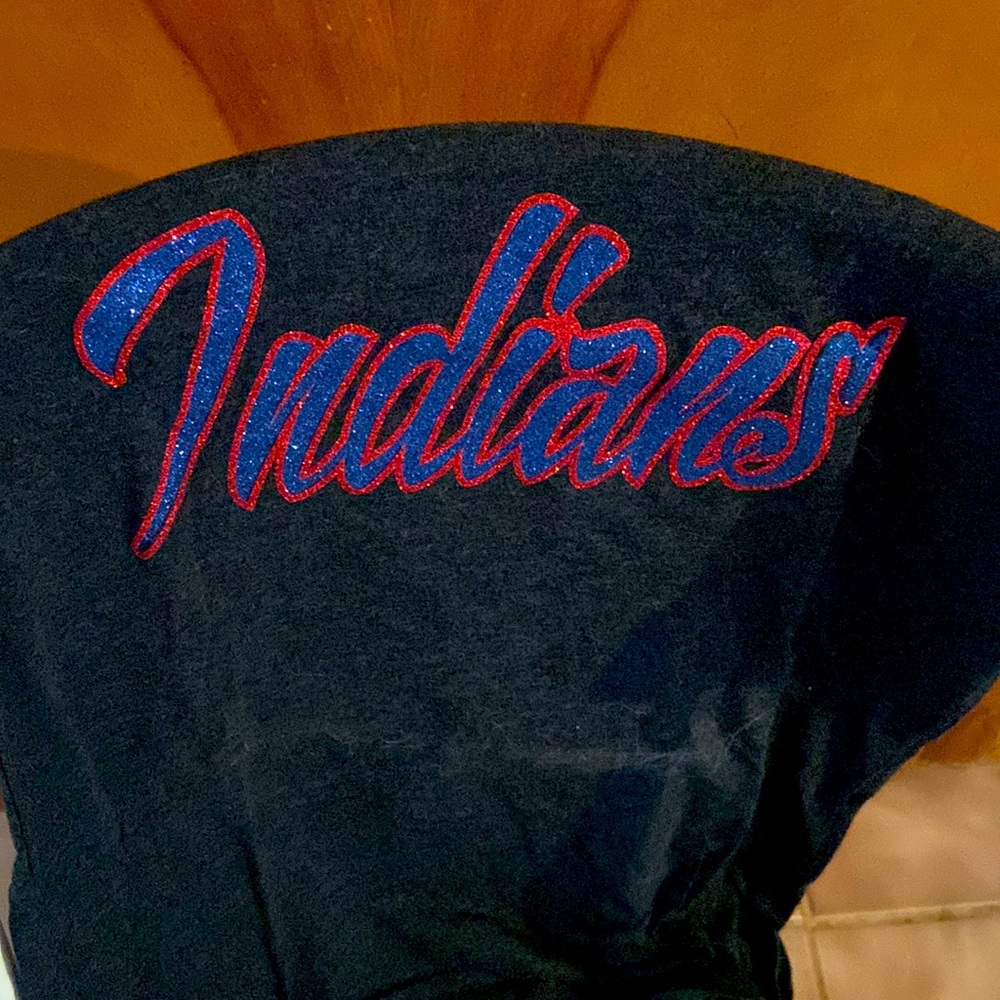 INDIANS TEE. Wording is in glitter blue and red. Tee is gray.